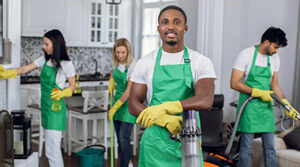 A cleaning crew dressed in cleaner gear.